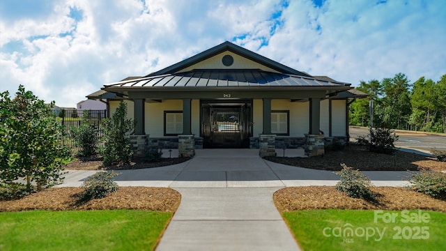921 Two Brothers Ln, York, SC 29745 - view of front facade featuring a standing seam roof, covered porch, and a metal roof