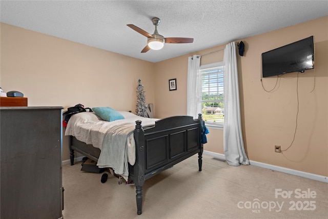 5750 Ellenwood Dr, Granite Falls, NC 28630 - bedroom featuring light carpet, baseboards, ceiling fan, and a textured ceiling