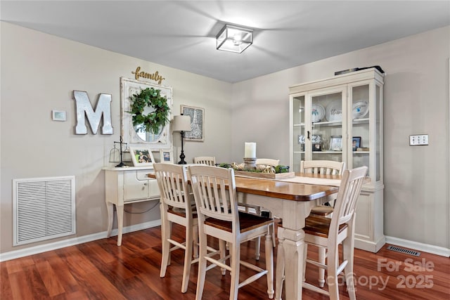 5750 Ellenwood Dr, Granite Falls, NC 28630 - dining area with dark wood-style flooring and baseboards