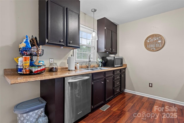 5750 Ellenwood Dr, Granite Falls, NC 28630 - kitchen featuring appliances with stainless steel finishes, a sink, dark wood finished floors, light countertops, and pendant lighting