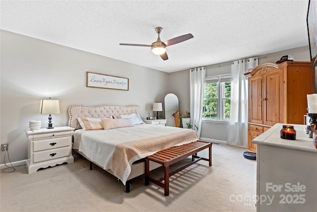 5750 Ellenwood Dr, Granite Falls, NC 28630 - bedroom with light carpet, baseboards, a textured ceiling, and ceiling fan