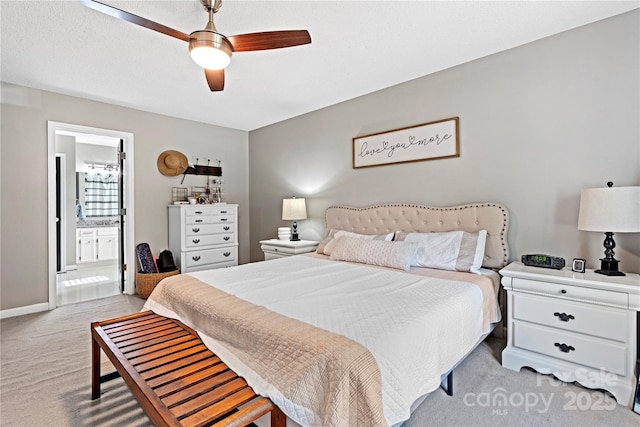 5750 Ellenwood Dr, Granite Falls, NC 28630 - bedroom with light carpet, connected bathroom, ceiling fan, and baseboards
