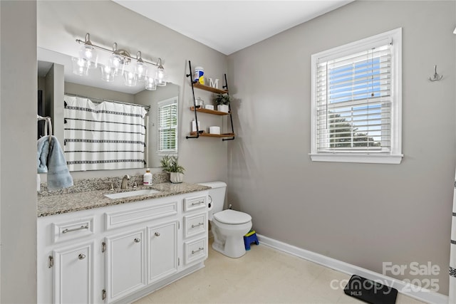 5750 Ellenwood Dr, Granite Falls, NC 28630 - bathroom featuring toilet, vanity, baseboards, and curtained shower
