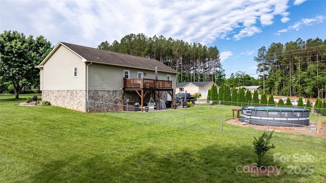 5750 Ellenwood Dr, Granite Falls, NC 28630 - back of property featuring a wooden deck and an outdoor pool