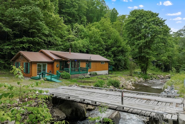 14518 Big Laurel Rd, Mars Hill, NC 28754 - view of front of home with a forest view, a boat dock, and metal roof