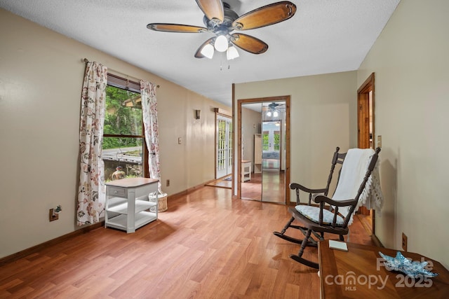 14518 Big Laurel Rd, Mars Hill, NC 28754 - living area with ceiling fan, light wood-style flooring, baseboards, and a textured ceiling