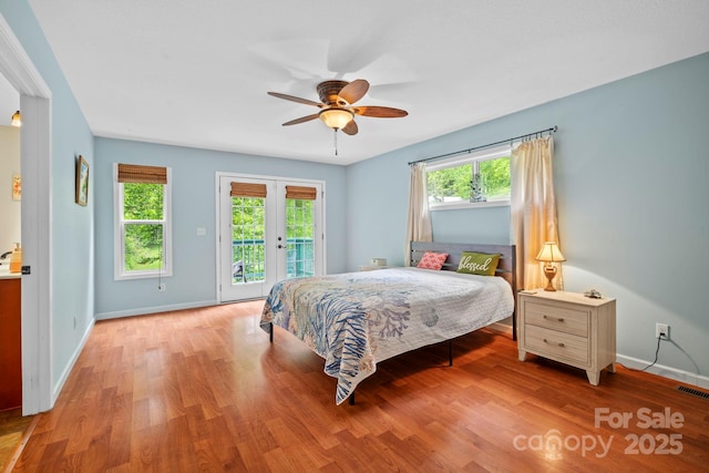 14518 Big Laurel Rd, Mars Hill, NC 28754 - bedroom featuring access to exterior, baseboards, wood finished floors, and ceiling fan