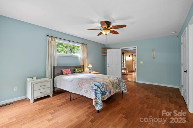 14518 Big Laurel Rd, Mars Hill, NC 28754 - bedroom with wood finished floors, baseboards, and a ceiling fan