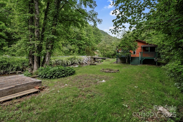 14518 Big Laurel Rd, Mars Hill, NC 28754 - view of grassy yard featuring a deck and a forest view