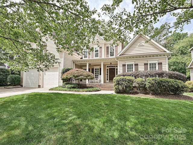 2406 Tarleton Twins Ter, Charlotte, NC 28270 - traditional-style house with a porch, concrete driveway, a front lawn, and an attached garage
