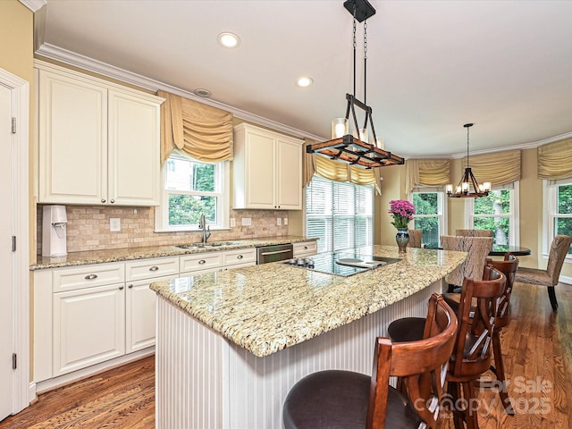 2406 Tarleton Twins Ter, Charlotte, NC 28270 - kitchen featuring black electric cooktop, a sink, dark wood-style floors, dishwashing machine, and a kitchen bar