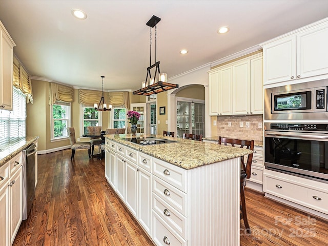 2406 Tarleton Twins Ter, Charlotte, NC 28270 - kitchen featuring stainless steel appliances, a chandelier, a center island, tasteful backsplash, and light stone counters