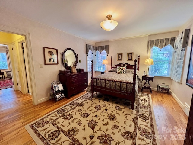 303 Wade E Vannoy Dr, West Jefferson, NC 28694 - bedroom with multiple windows, wood finished floors, ornamental molding, and baseboards