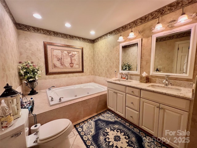 303 Wade E Vannoy Dr, West Jefferson, NC 28694 - full bathroom featuring toilet, a jetted tub, double vanity, tile patterned flooring, and recessed lighting