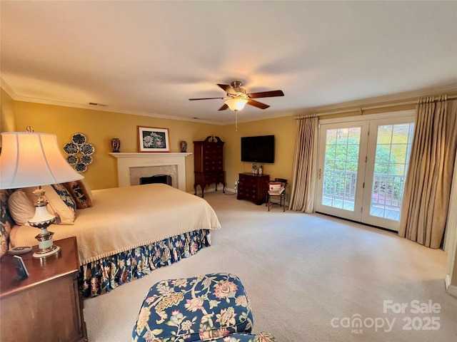 303 Wade E Vannoy Dr, West Jefferson, NC 28694 - bedroom featuring access to exterior, carpet, crown molding, ceiling fan, and a fireplace