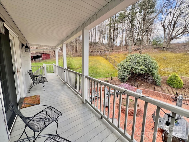 303 Wade E Vannoy Dr, West Jefferson, NC 28694 - wooden porch featuring a lawn