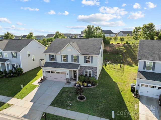 1725 Mill Creek Ln SW, Concord, NC 28025 - traditional-style house with driveway, stone siding, a front yard, and a residential view