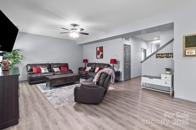 1725 Mill Creek Ln SW, Concord, NC 28025 - living room featuring wood finished floors, ceiling fan, and baseboards
