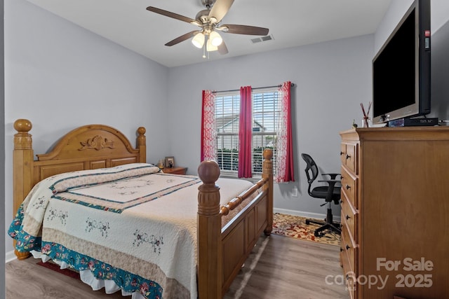 1725 Mill Creek Ln SW, Concord, NC 28025 - bedroom with wood finished floors, baseboards, and ceiling fan