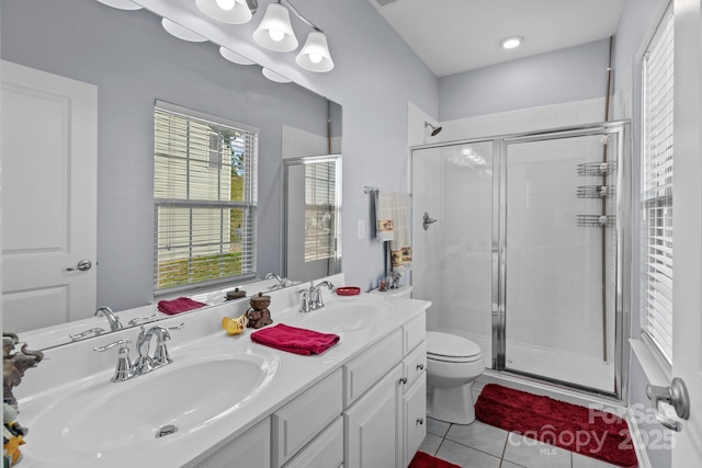1725 Mill Creek Ln SW, Concord, NC 28025 - bathroom with toilet, a stall shower, tile patterned floors, and double vanity
