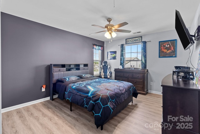 1725 Mill Creek Ln SW, Concord, NC 28025 - bedroom with wood finished floors, baseboards, and a ceiling fan