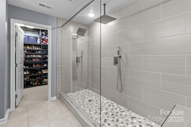 1725 Mill Creek Ln SW, Concord, NC 28025 - full bath featuring a shower stall, tile patterned flooring, a spacious closet, and baseboards