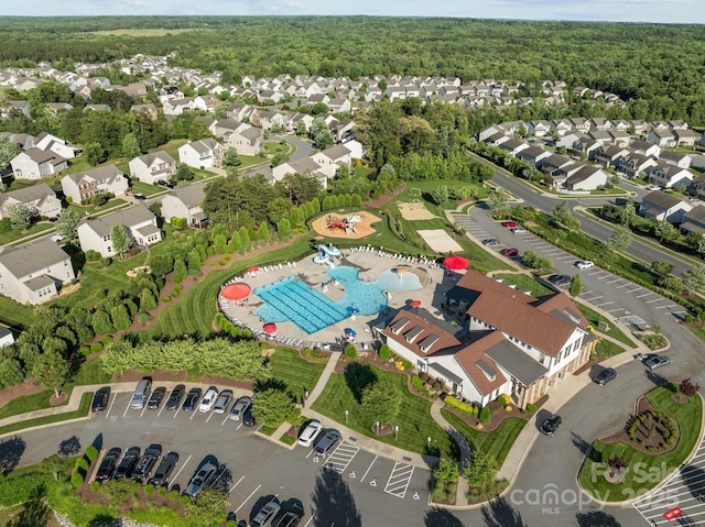 1725 Mill Creek Ln SW, Concord, NC 28025 - aerial overview of property's location with a pool and a heavily wooded area