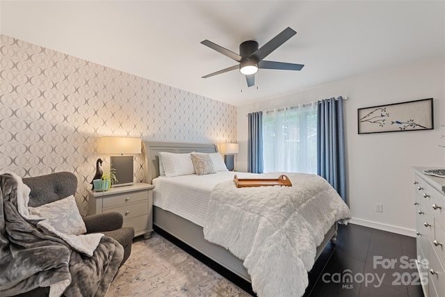 225 Valley View Ter, Waynesville, NC 28786 - bedroom featuring wallpapered walls, an accent wall, and a ceiling fan