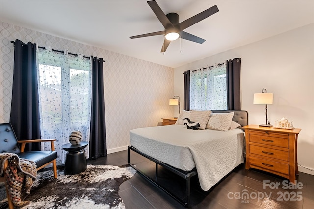 225 Valley View Ter, Waynesville, NC 28786 - bedroom with wallpapered walls, dark wood-style floors, and ceiling fan