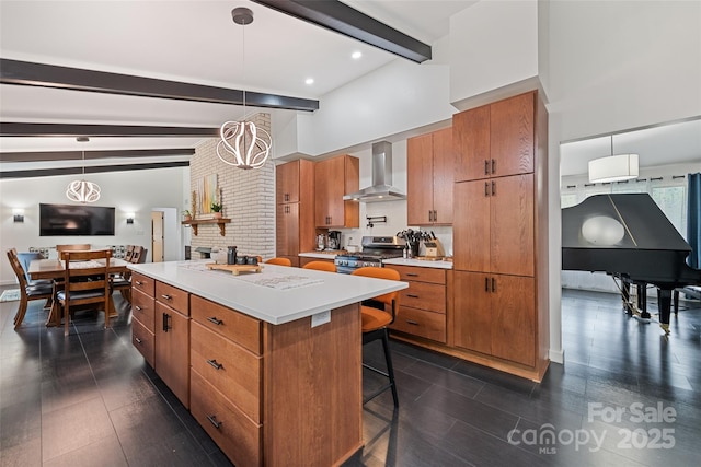 225 Valley View Ter, Waynesville, NC 28786 - kitchen with wall chimney exhaust hood, beam ceiling, brown cabinets, a breakfast bar area, and a kitchen island