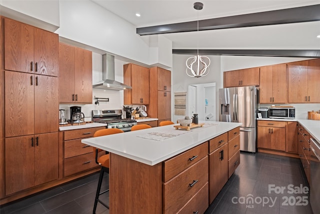 225 Valley View Ter, Waynesville, NC 28786 - kitchen with wall chimney exhaust hood, stainless steel appliances, brown cabinetry, light countertops, and a center island