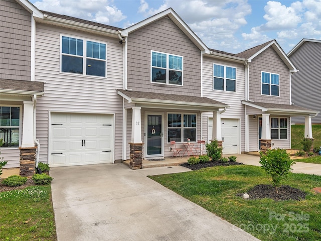32 Benedict Ln, Weaverville, NC 28787 - townhome / multi-family property featuring a garage, driveway, covered porch, and a shingled roof