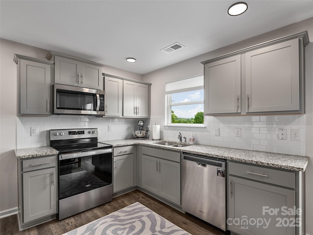 32 Benedict Ln, Weaverville, NC 28787 - kitchen with stainless steel appliances, gray cabinets, a sink, decorative backsplash, and recessed lighting