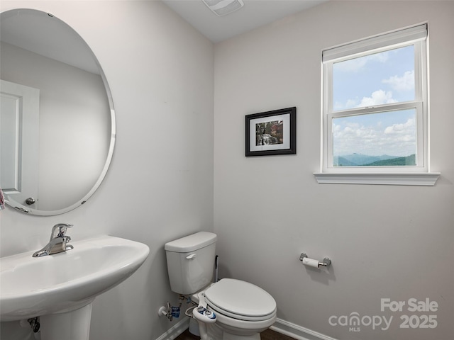 32 Benedict Ln, Weaverville, NC 28787 - half bathroom with baseboards, a sink, and toilet