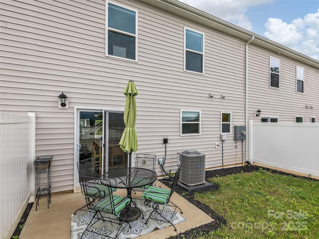 32 Benedict Ln, Weaverville, NC 28787 - back of property featuring cooling unit, a patio area, and outdoor dining area