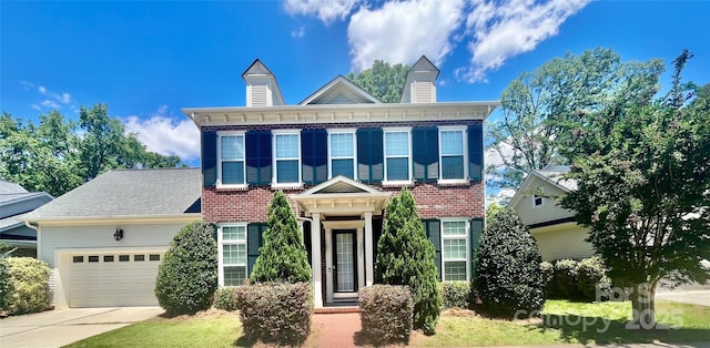 1025 N Sharon Amity Rd, Charlotte, NC 28211 - italianate house with an attached garage, brick siding, and concrete driveway
