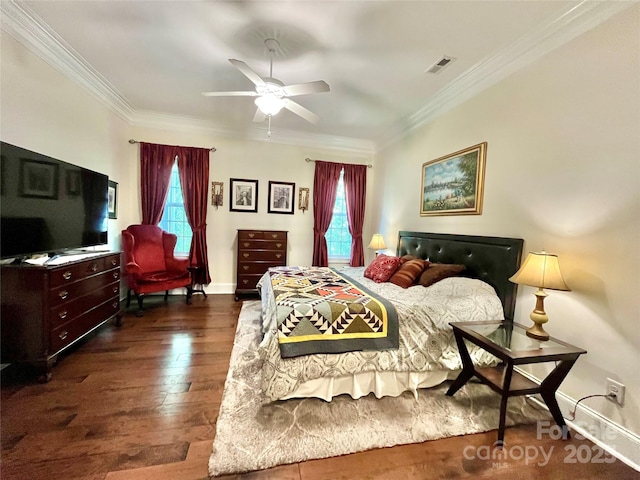 1025 N Sharon Amity Rd, Charlotte, NC 28211 - bedroom featuring multiple windows, ornamental molding, dark wood-type flooring, and baseboards