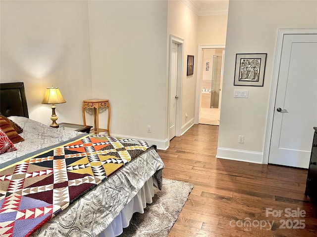 1025 N Sharon Amity Rd, Charlotte, NC 28211 - bedroom featuring crown molding, baseboards, and hardwood / wood-style flooring