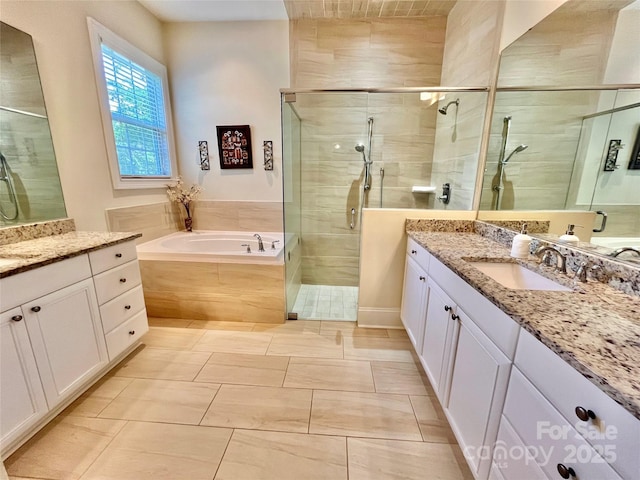 1025 N Sharon Amity Rd, Charlotte, NC 28211 - full bath featuring a stall shower, two vanities, and a garden tub