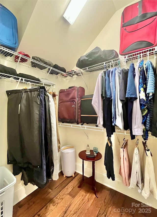 1025 N Sharon Amity Rd, Charlotte, NC 28211 - walk in closet featuring wood finished floors and lofted ceiling