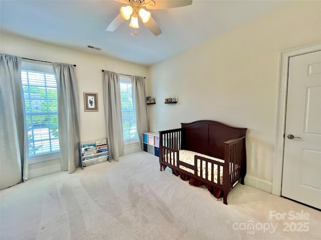 1025 N Sharon Amity Rd, Charlotte, NC 28211 - bedroom featuring carpet flooring, ceiling fan, a nursery area, and baseboards