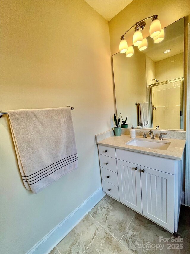 1025 N Sharon Amity Rd, Charlotte, NC 28211 - full bath with baseboards, vanity, and an enclosed shower