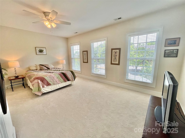 1025 N Sharon Amity Rd, Charlotte, NC 28211 - carpeted bedroom with baseboards and a ceiling fan