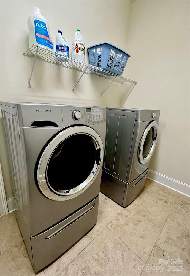 1025 N Sharon Amity Rd, Charlotte, NC 28211 - laundry room with washing machine and clothes dryer and baseboards