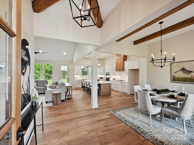 1172 Springlake Rd, York, SC 29745 - dining space featuring a chandelier, beamed ceiling, light wood-style floors, and high vaulted ceiling