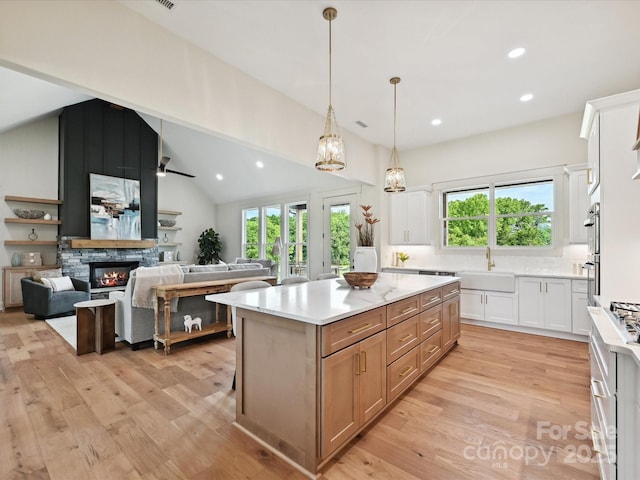 1172 Springlake Rd, York, SC 29745 - kitchen with a sink, light wood-type flooring, recessed lighting, lofted ceiling, and healthy amount of natural light