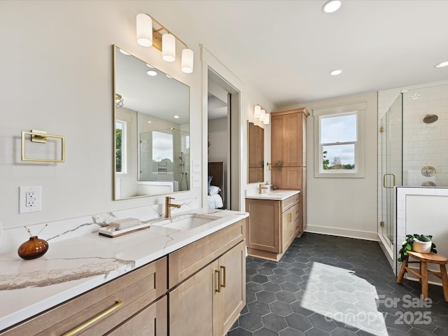 1172 Springlake Rd, York, SC 29745 - ensuite bathroom featuring healthy amount of natural light, two vanities, a shower stall, recessed lighting, and baseboards