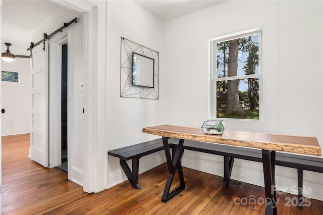 17 Springdale Ave, Asheville, NC 28803 - office with a barn door, wood finished floors, and baseboards