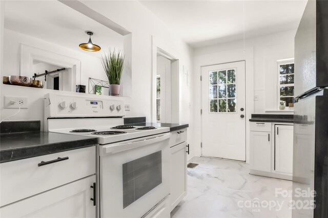17 Springdale Ave, Asheville, NC 28803 - kitchen featuring electric range, light marble finish floors, freestanding refrigerator, and dark countertops