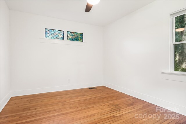 17 Springdale Ave, Asheville, NC 28803 - empty room with light wood-style floors, a ceiling fan, baseboards, and healthy amount of natural light